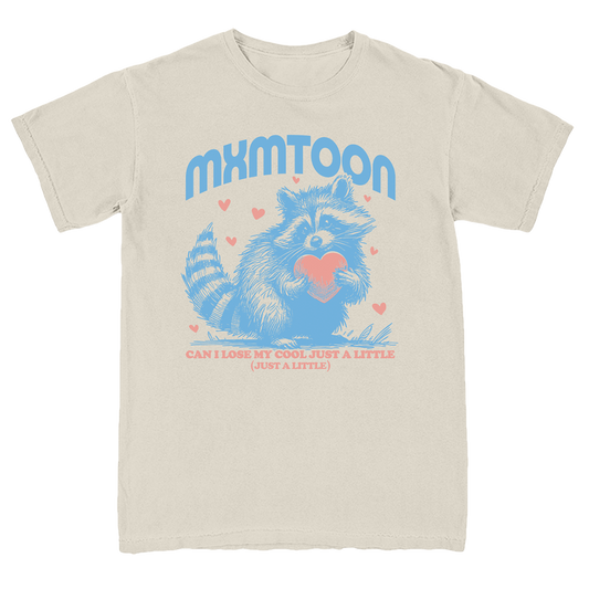 A light blue colored t-shirt with a graphic print of a raccoon and the text 'mxmtoon' along with the phrase 'Can I lose my cool just a little bit more?' surrounded by heart shapes.